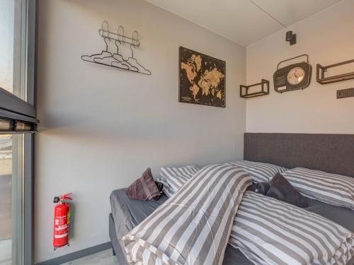 a bedroom with two beds and a fire extinguisher at Houseboat in Volendam near Fort Edam in Volendam