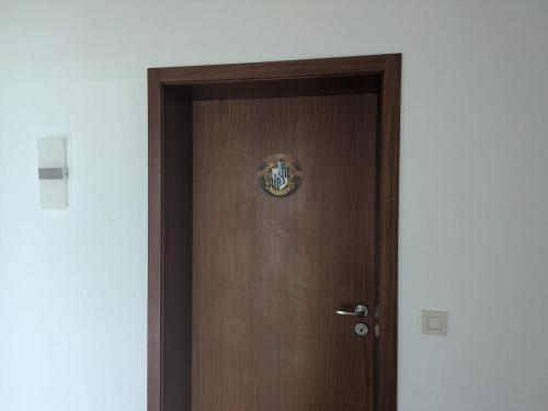 a wooden door with a sticker on it at Spacious and Luminous Apartment in a Bungalow in Züsch