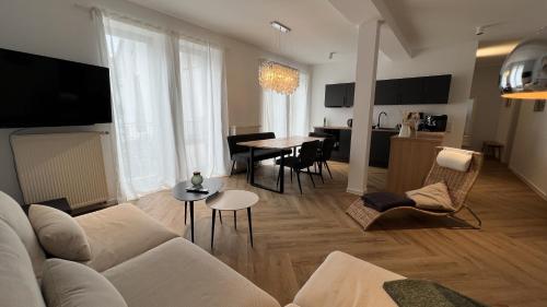 TV a/nebo společenská místnost v ubytování discovAIR - Zentral & Modern, inklusive Parkplatz, große Terrasse, 3 Schlafzimmer & Netflix & mehr