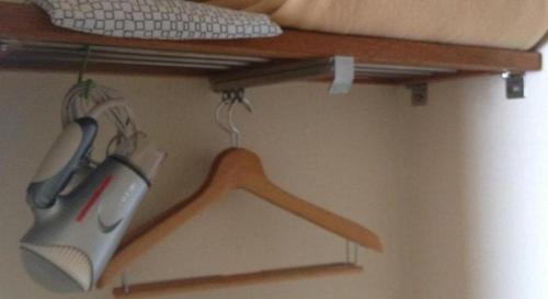 a computer mouse and a keyboard on a shelf at Marroad Inn Tokyo in Chofu
