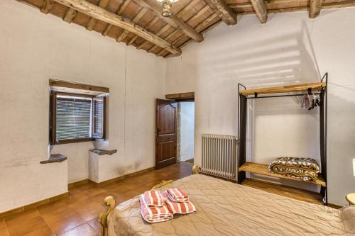 a bedroom with a bed in a room at Masia Mas Tibau in Girona