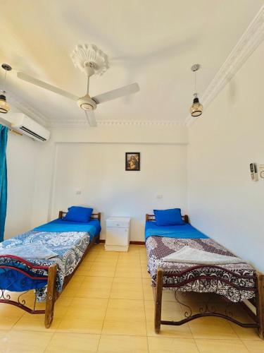 Postel nebo postele na pokoji v ubytování Luxor Guest House