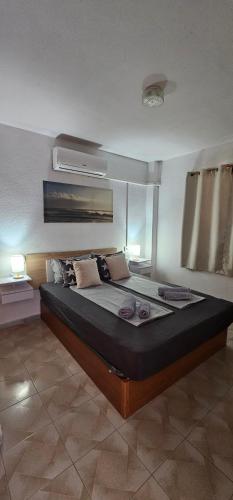a bedroom with a large bed in a room at Costa Blanka resident apartman in Torrevieja