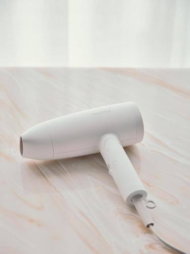 a white wii remote sitting on a table at FAV LUX Sapporo Susukino in Sapporo
