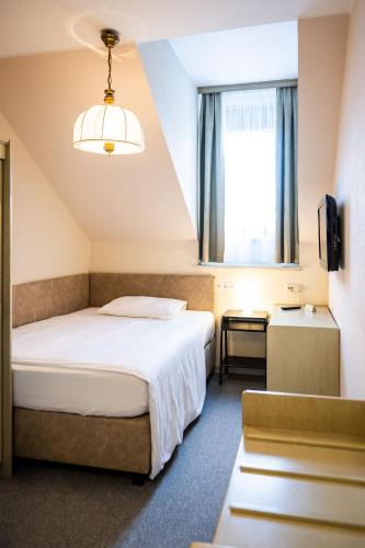 Motel Zeltweg - Self-Check-inにあるベッド