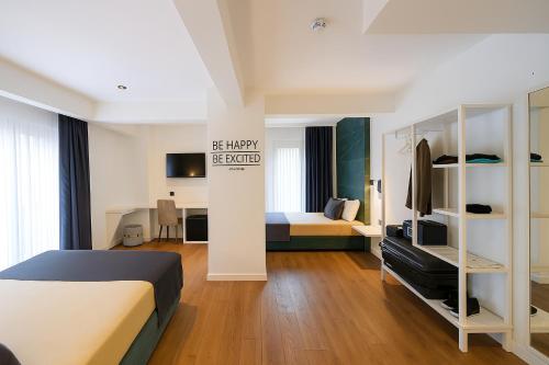 a hotel room with a bed and a bedroom at AXU AIRPORT HOTEL in Arnavutköy