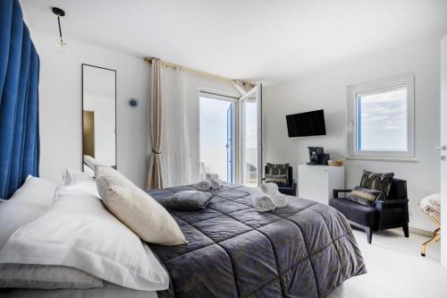 Altamarea - Sea view suitesにあるベッド