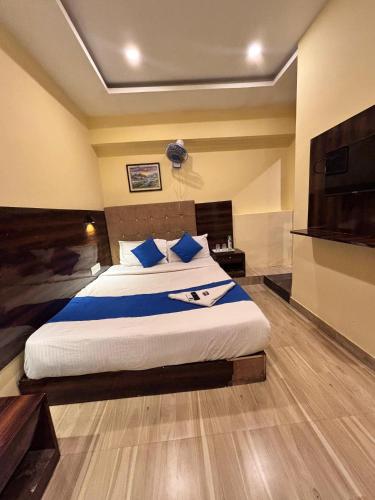 Postel nebo postele na pokoji v ubytování HOTEL SIGNATURE INN