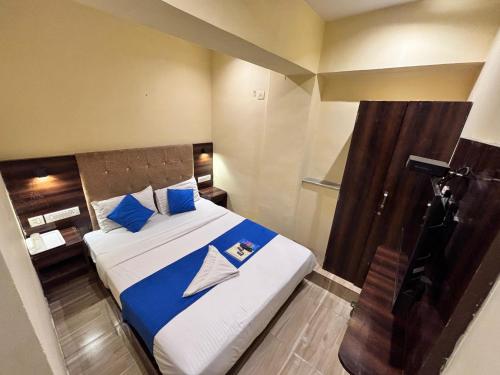 Postel nebo postele na pokoji v ubytování HOTEL SIGNATURE INN
