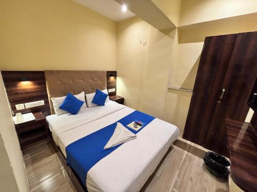 Postel nebo postele na pokoji v ubytování HOTEL SIGNATURE INN
