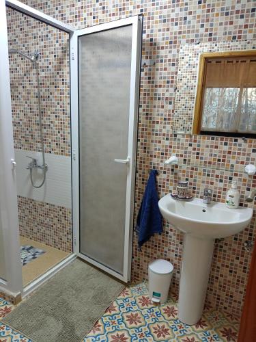 a bathroom with a shower and a sink at Maison d'Hôtes Casa Azla in Azla