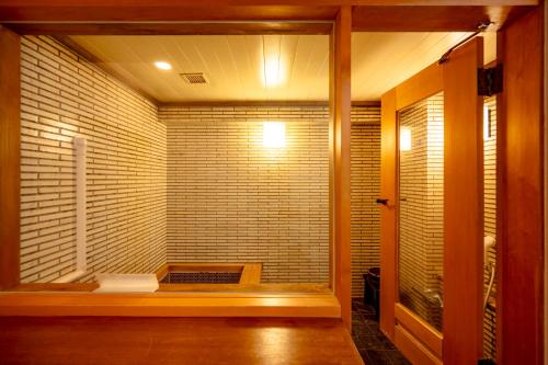a room with a sauna with a large window at Southern Cross Resort in Ito