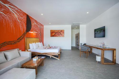 a living room with a couch and a table at Pearl of Trawangan in Gili Trawangan