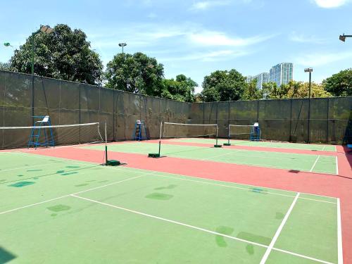 two tennis courts on a tennis court at 5 Star Apt Studio, Swimming Pool, Gyms, Quick To Airport in Hanoi