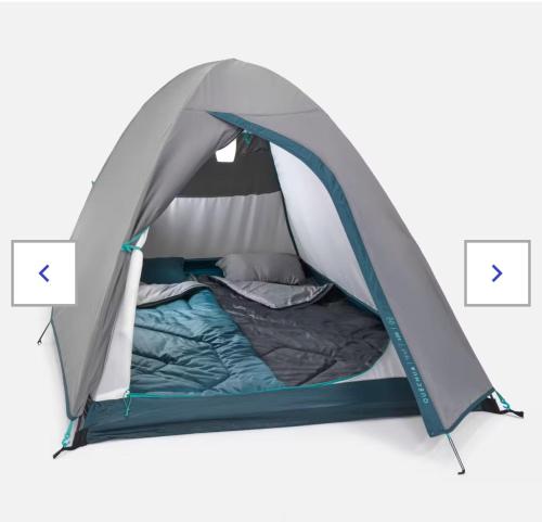 En eller flere senge i et værelse på Nature & Camping
