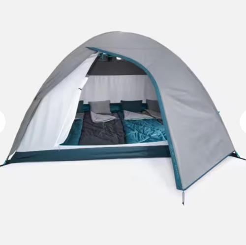 En eller flere senge i et værelse på Nature & Camping