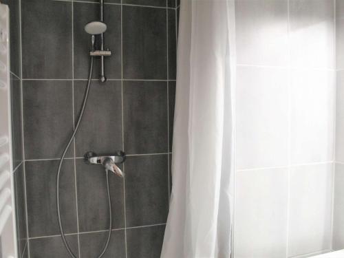 a shower with a shower head and a shower curtain at Appartement cosy 2 pièces, 8 couchages à Vars Les Claux - FR-1-330B-223 in Vars