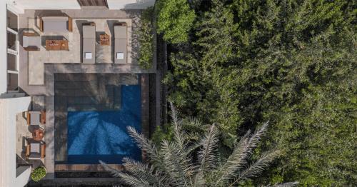 an aerial view of a house with a swimming pool at Park Hyatt Abu Dhabi Hotel and Villas in Abu Dhabi