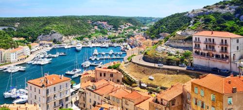 an aerial view of a harbor with boats in the water at Beau logement neuf à 5 mn de la mer in Ventiseri