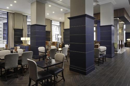 a restaurant with chairs and tables in a lobby at Hyatt Place Knoxville/Downtown in Knoxville