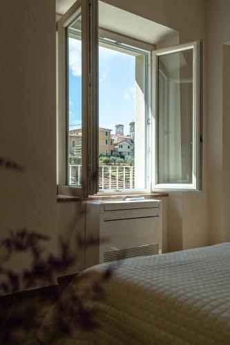 Katil atau katil-katil dalam bilik di Residenze Volpigliano