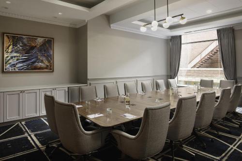 a conference room with a long table and chairs at Hyatt Place Knoxville/Downtown in Knoxville