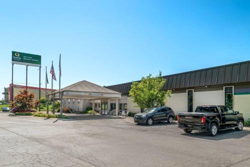 a dealership with a truck parked in front of a building at Quality Inn & Suites Next to the Casino in Ceresco