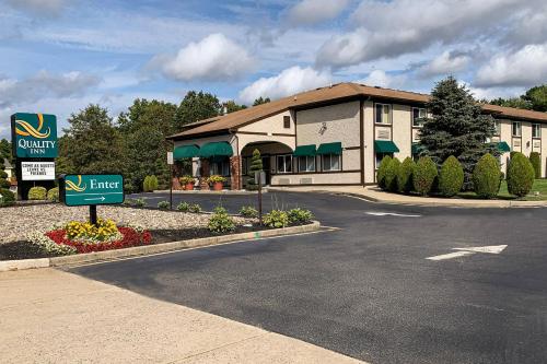 a hotel with a sign in front of a building at Quality Inn near Toms River Corporate Park in Manchester Township