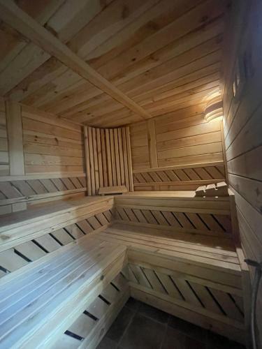 an empty sauna with wooden walls and ceilings at Vila Premiere Bistro-Spa in Piatra Neamţ