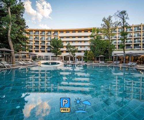 a large swimming pool in front of a hotel at HVD Club Bor Ultra All Inclusive - Private Beach & Free parking in Sunny Beach