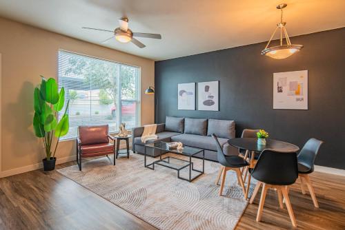 a living room with a couch and a table and chairs at The Luxe Lookout Balcony Pool Sleeps 4 in Tempe