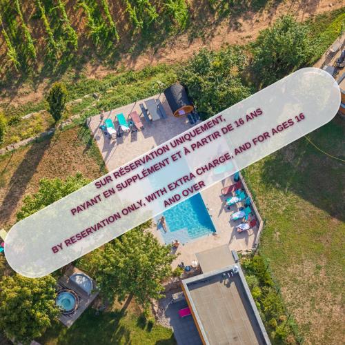an overhead view of a surfboard next to a swimming pool at Hôtel du Bollenberg - Restaurant "Côté Plaine" - Spa de la Colline in Westhalten