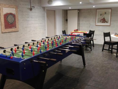 a large chess board in a room with chairs at B&B Hotel Mattli Übernachtung Frühstück in Morschach