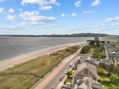 an aerial view of a beach and the ocean at Beach Walk Apartment in Broughty Ferry