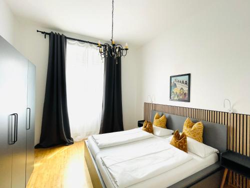 a bedroom with a bed and a window at APSTAY City Center I FREE Parking I Self Check-in in Graz