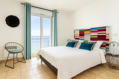 Ένα ή περισσότερα κρεβάτια σε δωμάτιο στο Vue exceptionnelle début Cap Corse La Pier Noire