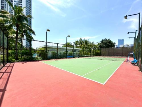 a tennis court with a tennis racket on it at Five Star Studio Apartment Near Marriott Hotel and Keangnam in Hanoi