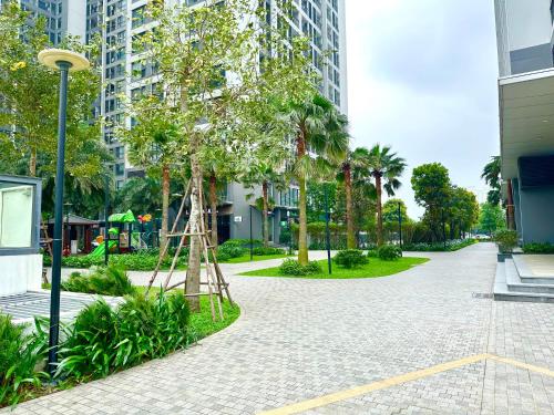 a park with a tree in the middle of a street at Five Star Studio Apartment Near Marriott Hotel and Keangnam in Hanoi