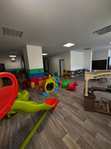 a play room with many different types of play equipment at Hotel Pod Radnicí in Šumperk
