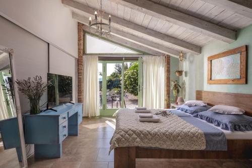 a bedroom with two beds and a large window at Tiny House With Private Pool Kostrena - Happy Rentals in Kostrena