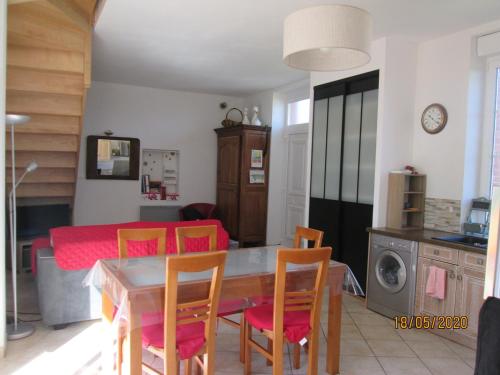 a kitchen and dining room with a table and chairs at Modern holiday home in Crux-La-Ville with terrace in Crux-la-Ville