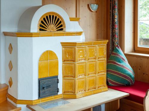 a toy kitchen with a stove in a room at Welcoming apartment in Stummerberg with terrace in Stummerberg