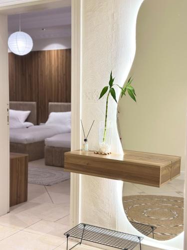 a room with a table with a plant on it at Apartment N6 with kitchen in Medina