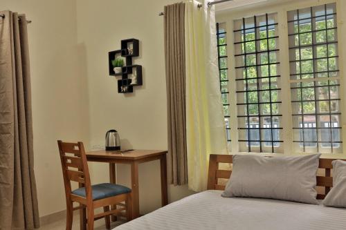 Ένα ή περισσότερα κρεβάτια σε δωμάτιο στο Prithvi Nila Heavens 3 BHK Homestay Ground Floor