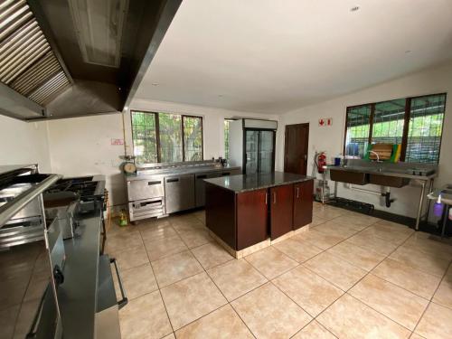 a kitchen with a sink and a counter top at Pleasant Waters Lodge & Conference Venue in Durban