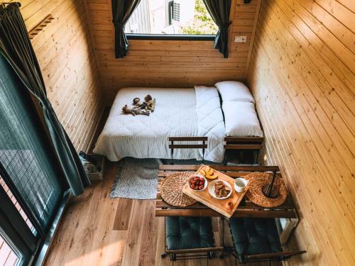an overhead view of a bedroom in a tiny house at Whispers of the Willow 2 by Tiny Away in Estramiac