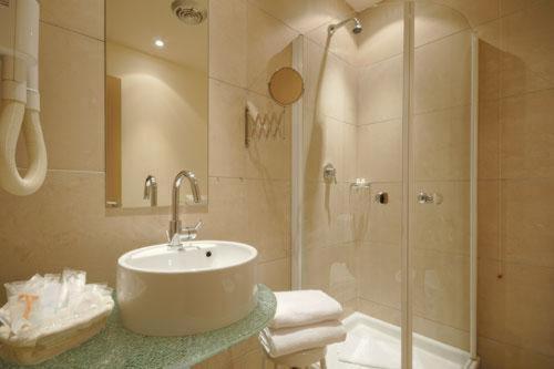 a bathroom with a sink and a shower at B&B HOTEL First in Calenzano