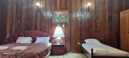 Ένα ή περισσότερα κρεβάτια σε δωμάτιο στο Hotel Estancia Itapúa