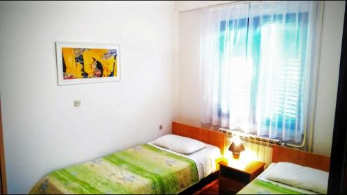 Posteľ alebo postele v izbe v ubytovaní Apartments Kalac