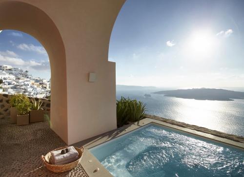 a view of the ocean from a villa with a swimming pool at Villa Bordeaux in Fira